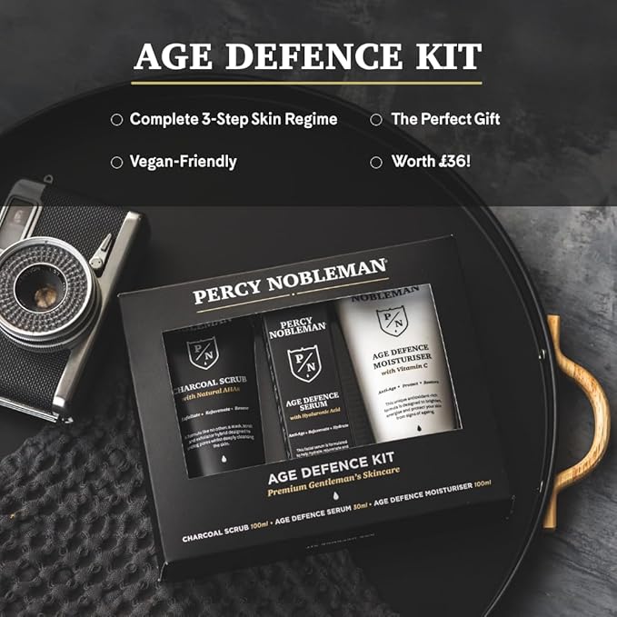 Age Defence Kit, a men's skincare set containing Charcoal Face Scrub (with Natural AHAs), ultra-hydrating Facial Serum (with Hyaluronic Acid), and Moisturiser (with Vitamin C)